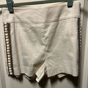 Bebe white embellished zip back shorts